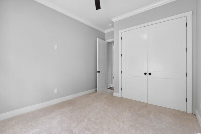 309 Waterfall Cir, Little River, SC 29566 - unfurnished bedroom with crown molding, carpet floors, a closet, a ceiling fan, and baseboards