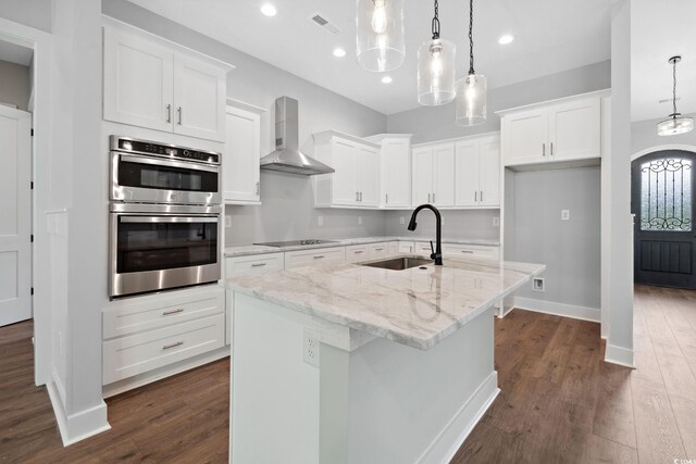 309 Waterfall Cir, Little River, SC 29566 - kitchen with wall chimney range hood, double oven, a sink, black electric stovetop, and dark wood-type flooring