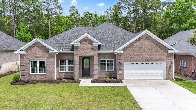 297 Waterfall Cir, Little River, SC 29566 - view of front of property featuring a garage, roof with shingles, brick siding, concrete driveway, and a front yard