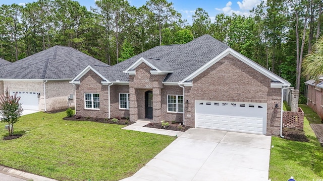 297 Waterfall Cir, Little River, SC 29566 - view of front of home with an attached garage, concrete driveway, brick siding, a front yard, and roof with shingles