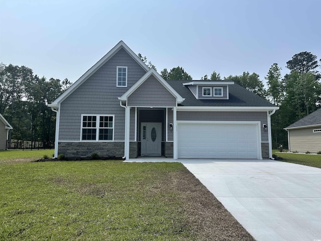 650 Timber Creek Dr, Loris, SC 29569 - craftsman house featuring stone siding, concrete driveway, a front yard, a garage, and a shingled roof