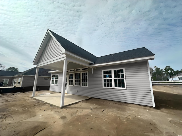 rear view of property featuring a patio