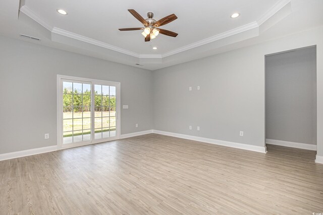 kitchen with pendant lighting, appliances with stainless steel finishes, a center island with sink, and white cabinets