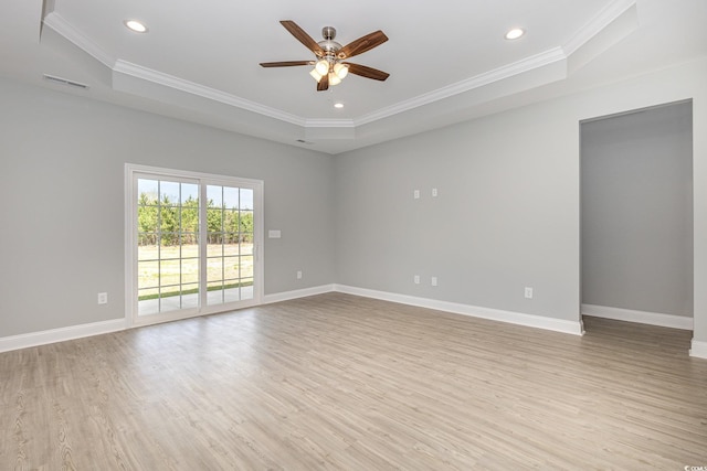 650 Timber Creek Dr, Loris, SC 29569 - unfurnished room featuring a tray ceiling, light wood-style floors, ceiling fan, ornamental molding, and recessed lighting
