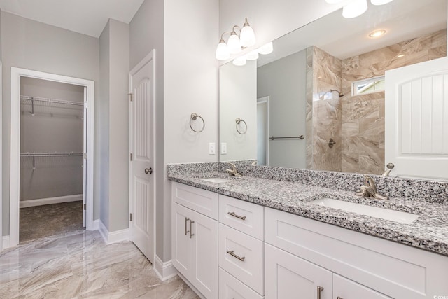 650 Timber Creek Dr, Loris, SC 29569 - bathroom featuring double vanity, marble finish floors, baseboards, a walk in shower, and a spacious closet