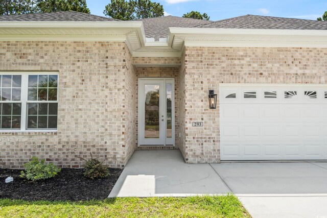293 Waterfall Cir, Little River, SC 29566 - unfurnished living room with a raised ceiling, ornamental molding, light wood-style floors, ceiling fan, and a chandelier