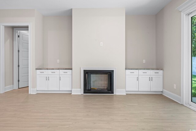 293 Waterfall Cir, Little River, SC 29566 - unfurnished living room with a tray ceiling, a ceiling fan, light wood-style flooring, recessed lighting, and a chandelier
