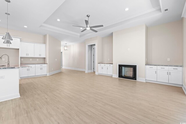 293 Waterfall Cir, Little River, SC 29566 - unfurnished dining area featuring a chandelier, ornamental molding, light wood-style floors, and a raised ceiling