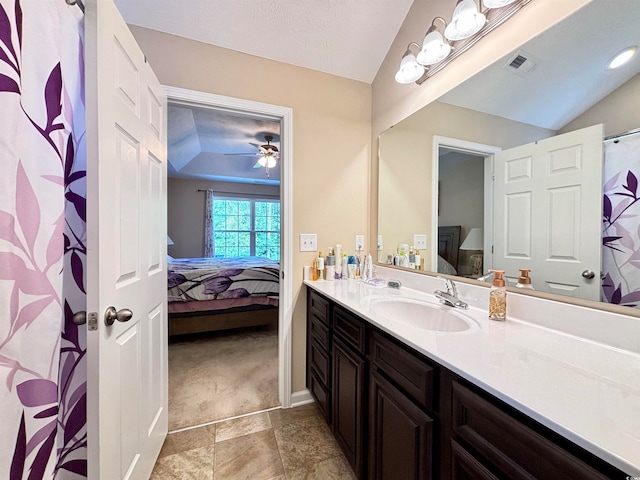 bathroom with vanity, lofted ceiling, and ceiling fan