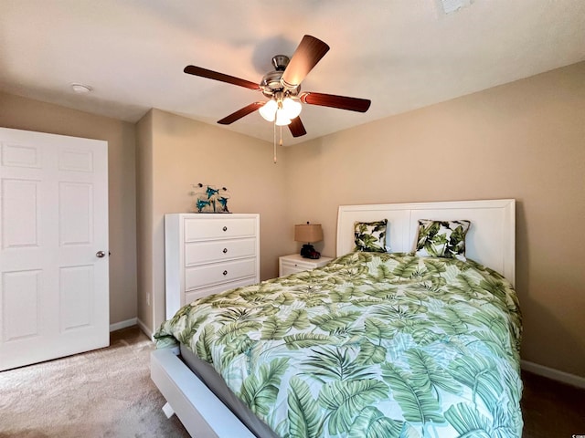 bedroom with ceiling fan and light carpet