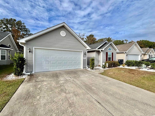 ranch-style house with a front yard and a garage