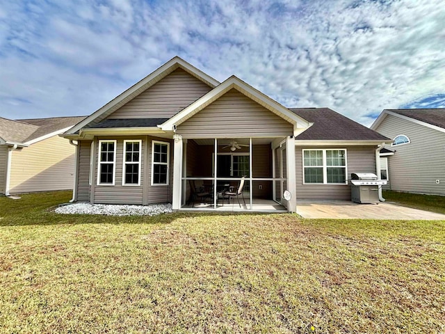 back of house featuring a yard and a patio