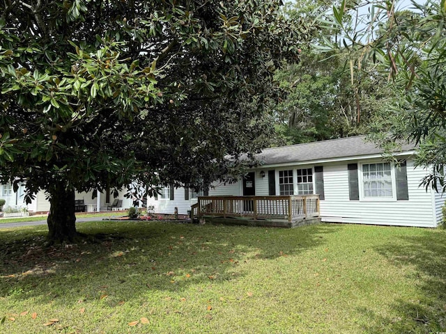 view of front facade with crawl space, a deck, and a front lawn