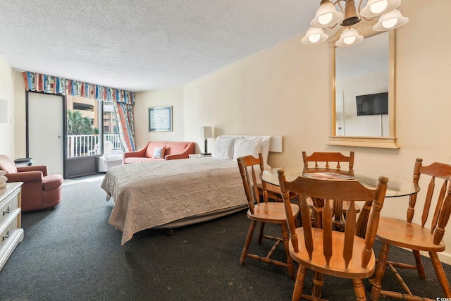 bedroom featuring access to outside, a textured ceiling, carpet flooring, and an inviting chandelier