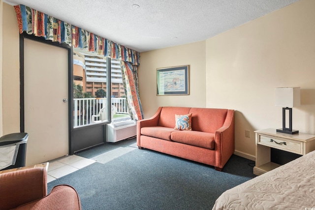 bedroom with carpet floors and a textured ceiling