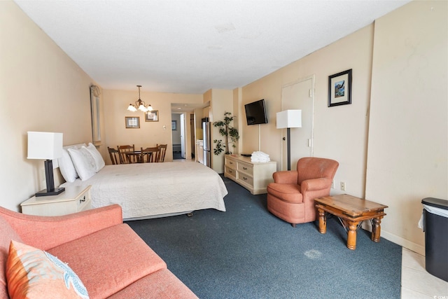 bedroom with light carpet and a notable chandelier