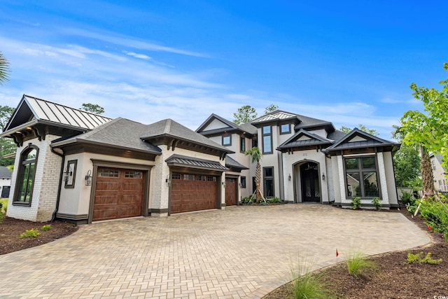 372 Chamberlin Rd, Myrtle Beach, SC 29588 - view of front of home featuring an attached garage, decorative driveway, and a standing seam roof