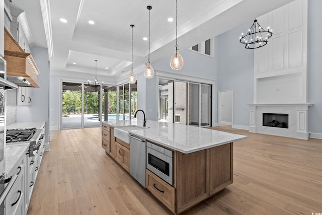 372 Chamberlin Rd, Myrtle Beach, SC 29588 - kitchen with a chandelier, stainless steel appliances, crown molding, a raised ceiling, and a large island