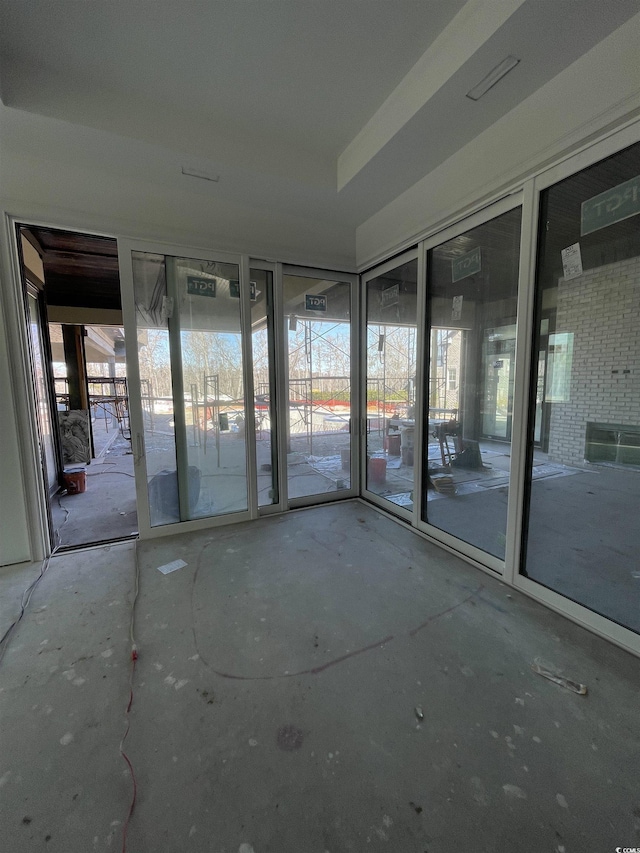 unfurnished sunroom with a wealth of natural light