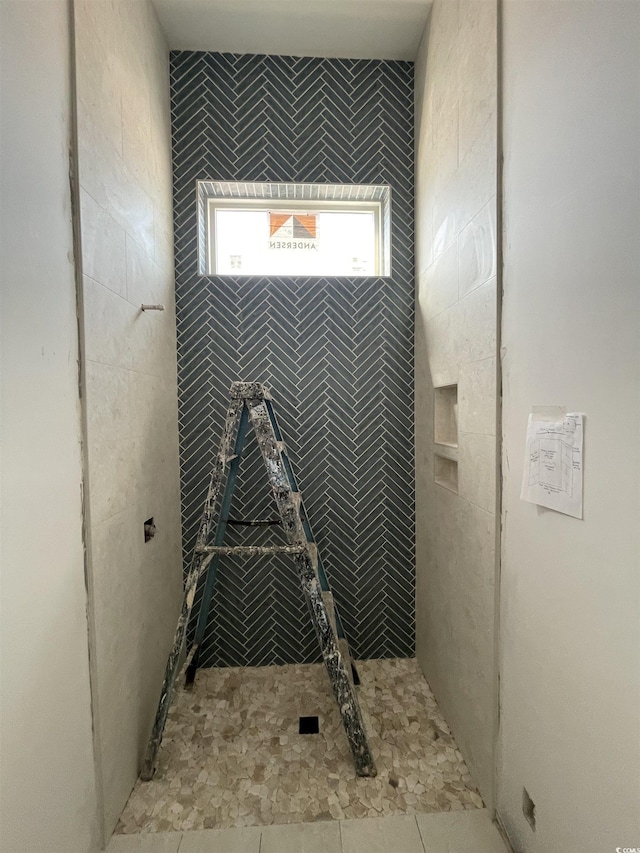 full bathroom with tiled shower