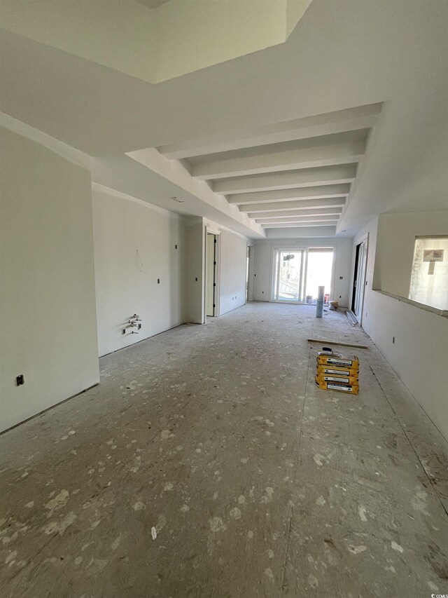 spare room with beam ceiling