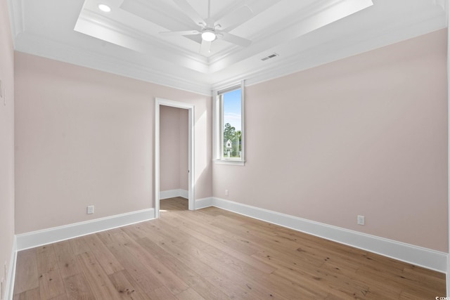 372 Chamberlin Rd, Myrtle Beach, SC 29588 - unfurnished room with a raised ceiling, crown molding, ceiling fan, light wood-style floors, and recessed lighting
