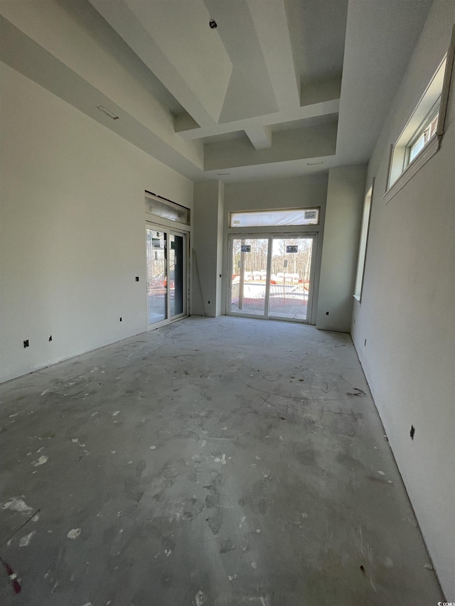 unfurnished room with a high ceiling