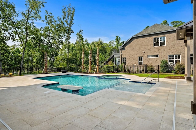 372 Chamberlin Rd, Myrtle Beach, SC 29588 - view of pool with a patio, a pool with connected hot tub, and view of scattered trees