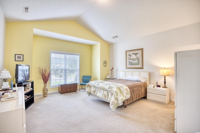 bedroom featuring lofted ceiling, light colored carpet, and baseboards