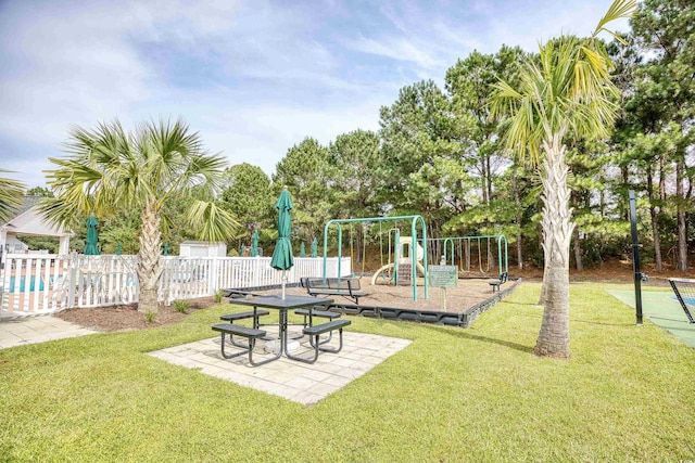 community jungle gym featuring a patio