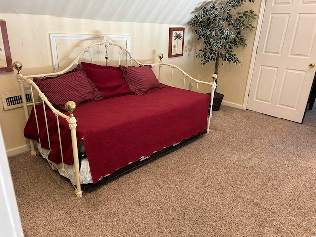 bedroom featuring vaulted ceiling and carpet floors