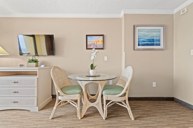 dining area featuring crown molding, a textured ceiling, and light hardwood / wood-style flooring