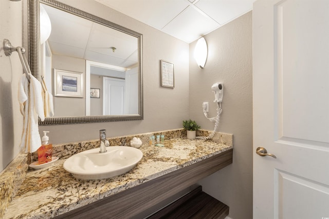 bathroom featuring vanity and a paneled ceiling