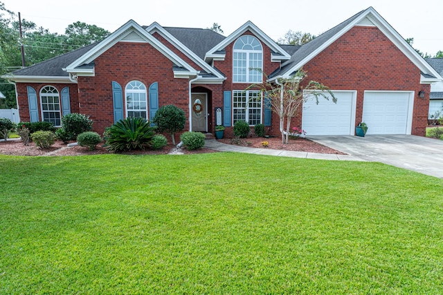 view of front facade with a front yard and a garage