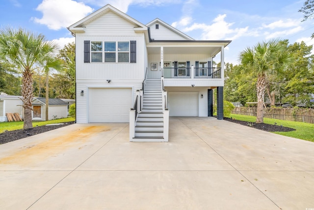 coastal home featuring a garage and a porch