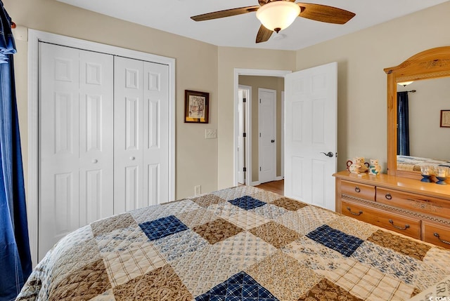 bedroom featuring ceiling fan and a closet