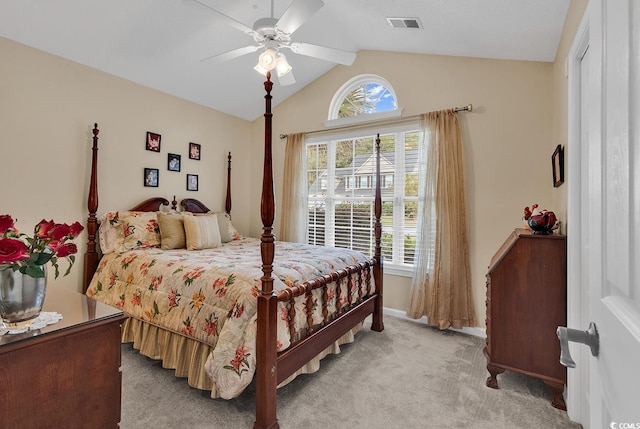 bedroom featuring ceiling fan, light colored carpet, and vaulted ceiling