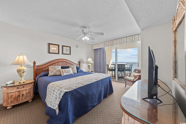 bedroom with access to outside, ceiling fan, carpet floors, and a textured ceiling