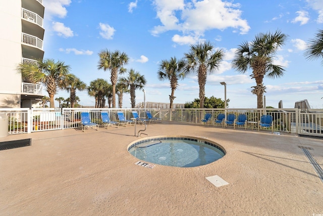 view of swimming pool featuring a community hot tub