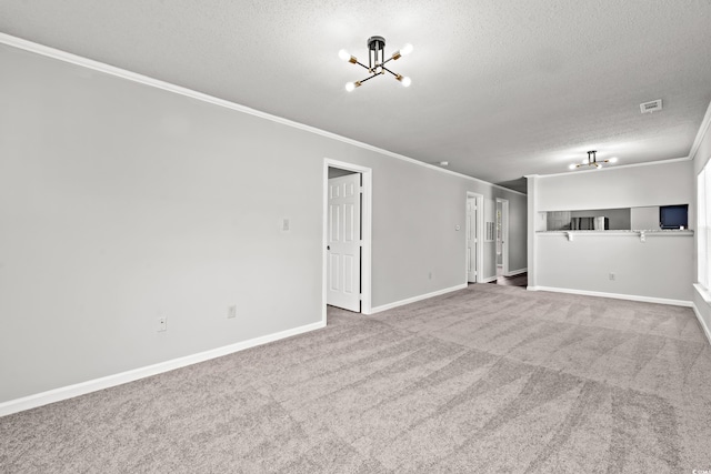 unfurnished living room with crown molding, a textured ceiling, carpet floors, and a chandelier