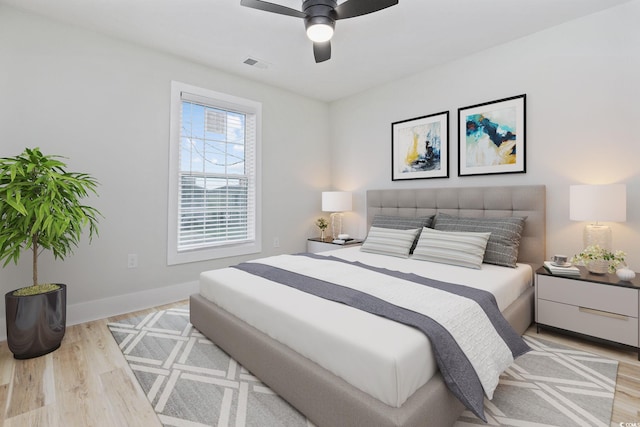 bedroom featuring ceiling fan and light hardwood / wood-style flooring