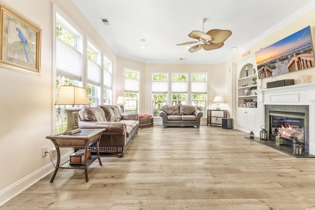 sunroom featuring ceiling fan