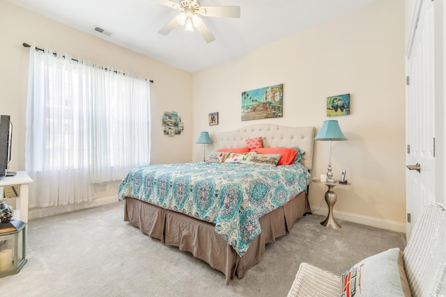 carpeted bedroom with ceiling fan