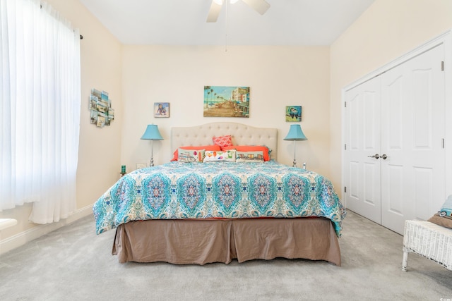 bedroom with a closet, carpet, and ceiling fan