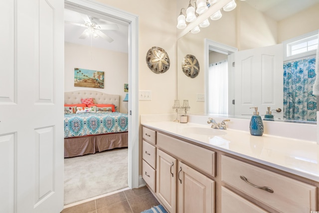 bathroom featuring ceiling fan, vanity, and tile patterned flooring