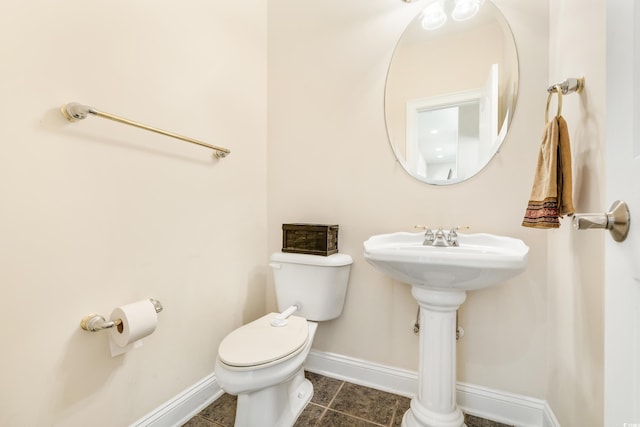 bathroom featuring tile patterned floors and toilet