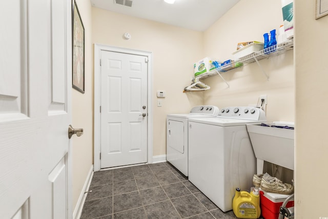 laundry room featuring separate washer and dryer and sink