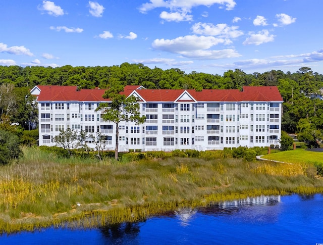 view of building exterior featuring a water view