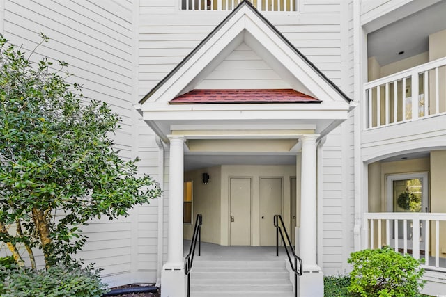 entrance to property featuring a balcony