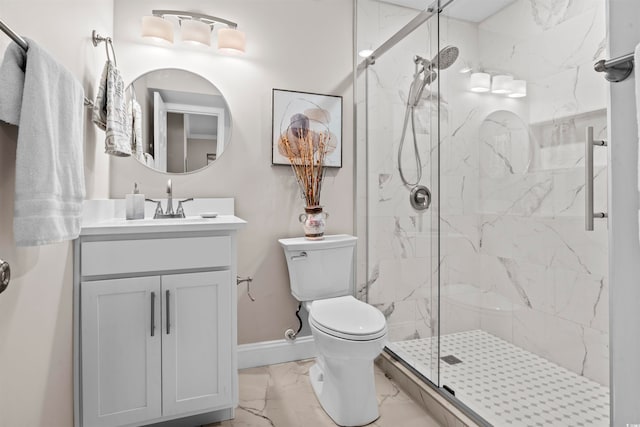 bathroom featuring a shower with door, vanity, and toilet